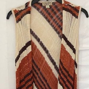One world long chin length sweater vest with fringe at the bottom. Bohemian.